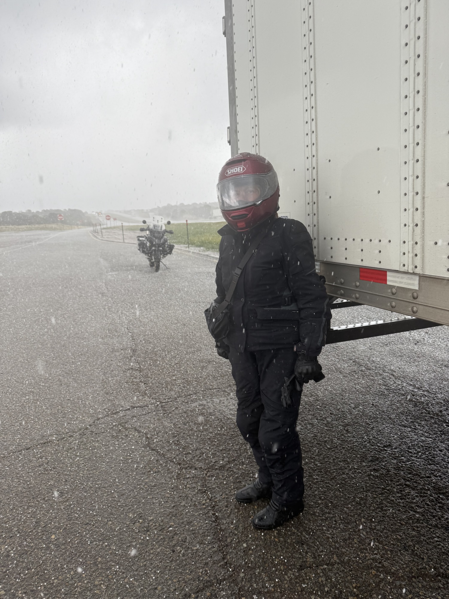 Sheltering from a hailstorm while traveling by motorbike